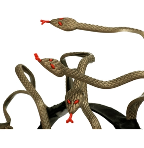 Macro detail of bronze Medusa snake headband showing realistic scale textures and red eyes