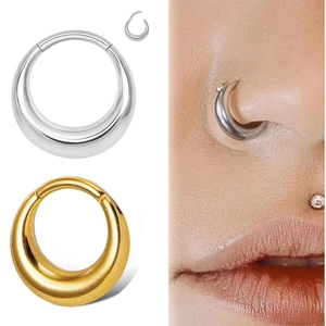 Detailed view of gold and silver seamless segment nose rings for ear and lip piercings