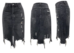 Detail view of dark grey washed denim skirt featuring ripped holes and frayed tassel hem