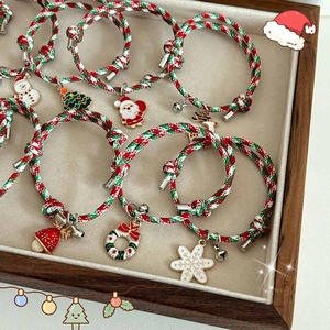 Handmade Christmas woven bracelets with enamel pendants including Santa and reindeer