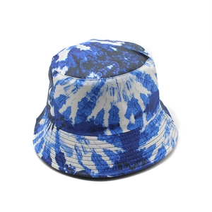 Close-up of blue and white tie-dye pattern on the cotton bucket hat fabric texture