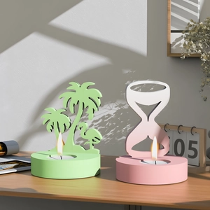 Detailed view of palm tree and hourglass silicone candle holder molds for DIY resin crafts