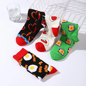 Set of four cotton mid-calf socks with chili, strawberry, toast, and egg patterns