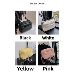 Detailed view of four pebbled PU leather crossbody bags with wide striped shoulder straps