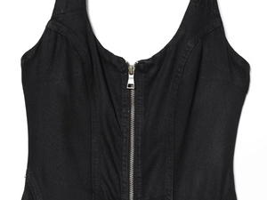 Detailed view of the black halter dress neckline featuring a metallic zipper and twill fabric
