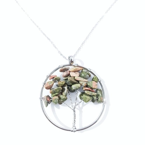 Detail of handmade Tree of Life pendant with natural multi-color healing crystal stones