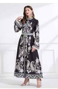 Close-up of vintage paisley print and intricate lace trim on the retro long dress sleeve