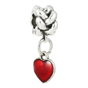 Detail of silver knot charm with red enamel heart pendant for DIY jewelry bracelets