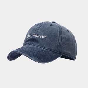 Detail of Los Angeles embroidery on navy blue washed cotton vintage baseball cap