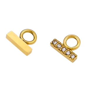 Detail of 18K gold-plated rectangular pendants with white zircon stones and polished finish