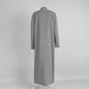 Detailed back view of a soft grey long-sleeve knitted maxi dress with high collar design