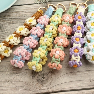 Handmade woven daisy flower wrist straps with gold rings in six diverse color sets