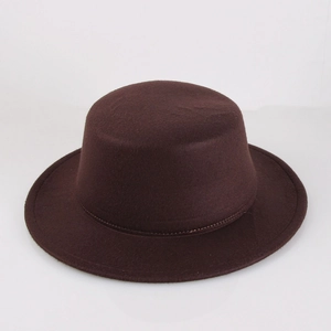 Macro shot of dark brown wool felt fabric and clean stitching on the classic fedora hat
