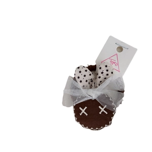 Cute brown rabbit hair tie with white mesh ears and polka dot fabric on white background