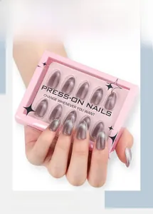 Detail of almond-shaped cat eye press-on nails in mauve gray with pink display box