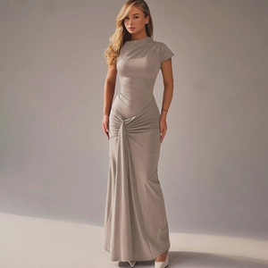 Detail of the waist ruched knot and draped fabric on a slim fit grey maxi dress