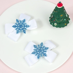 Set of two white Christmas hair bows with blue glitter snowflake accents for girls