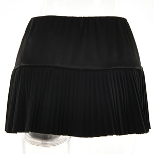 Detail view showing professional pleat design and black fabric texture of the mini skirt