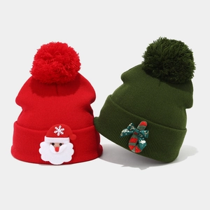 Winter knitted Christmas hats featuring Santa Claus and candy cane decorations in red and green