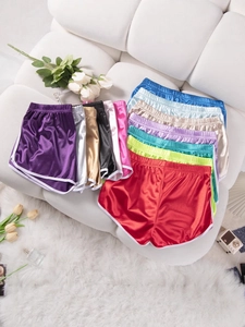 Metallic satin sports shorts in multiple colors with elastic waist and white piping trim