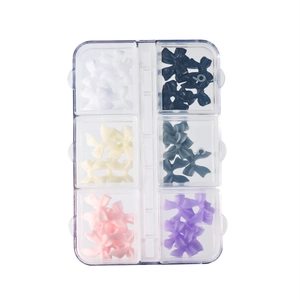 6-grid storage box with colorful resin butterfly nail art charms in diverse shades