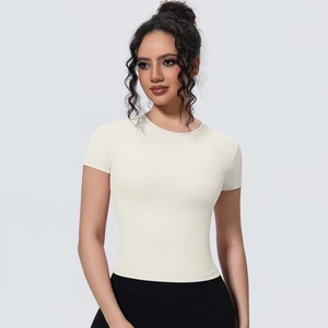 Close-up of off-white athletic t-shirt showing the elastic fabric and slim fit design