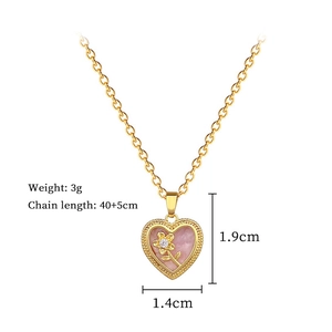 Detail of gold heart pendant showing dimensions and pink floral inlay on a 40cm chain