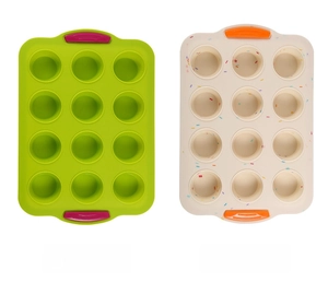 Detail of 12-cup silicone muffin pan with anti-slip handles and colorful dot pattern