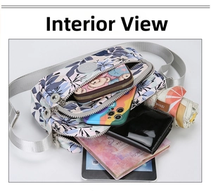 Floral crossbody bag showing multi-compartment storage for tablet, umbrella, and wallet