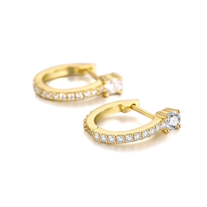 Close-up of S925 sterling silver curved wave earrings with paved white zircons
