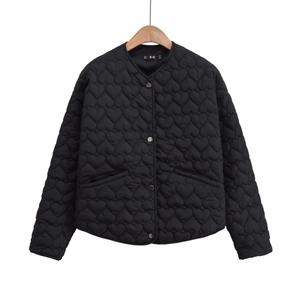 Women's black quilted jacket with heart pattern stitching and metal buttons