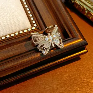 Vintage gold bow-knot butterfly open ring with zircon inlay and woven metal detail