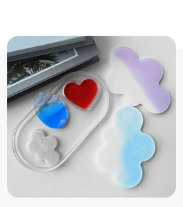 Close-up of food grade silicone molds in cloud and heart shapes for resin casting