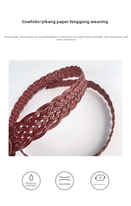 Macro detail of hand-woven dark red cowhide belt showing durable braiding and texture
