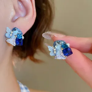 Blue crystal and pearl floral stud earrings with 18k gold plating for women