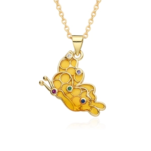 Detail of colorful butterfly pendant with vibrant enamel inlay and sparkling crystals