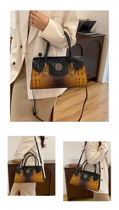 Detail of yellow and black crocodile pattern crossbody bag with metal ring buckle