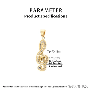 Close-up of golden music clef pendant with dimensions showing iced-out rhinestones