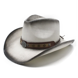 Detail of vintage woven cowboy hat featuring shell studs and gradient spray paint finish