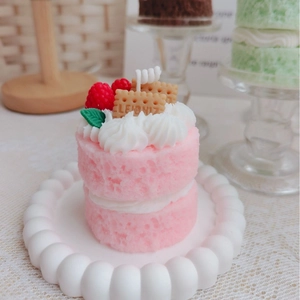 Scented double-layer strawberry cake candle with cream, berries and biscuits decor