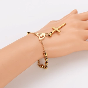 Stainless steel beaded heart and cross pendant bracelet on a jewelry hand model