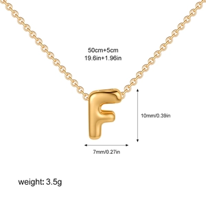 Macro view of golden bubble letter F pendant necklace with 50cm chain and size measurements