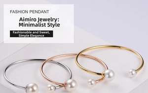 Detailed view of three open pearl bracelets in silver, gold, and rose gold finishes