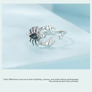 Detailed macro view of S925 sterling silver scorpion ring with dark teardrop gemstone