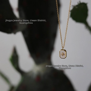 Detailed macro view of 18K gold plated necklace with white shell starburst pendant
