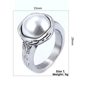 Detail view of pearl ring with textured silver band showing 15mm width and 29mm height dimensions