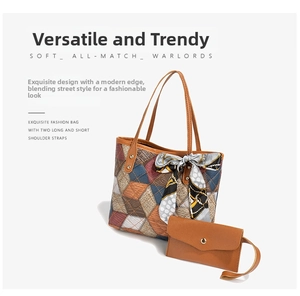 Detail view of large geometric patchwork tote bag with matching pouch and silk scarf