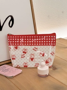 Detail of waterproof PVC pouch featuring cute bear prints and red checkered patterns