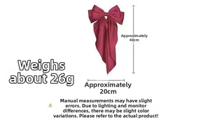 Detailed view of wine red satin bow hair clip with 40cm length and 26g weight specifications