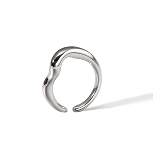 Detailed macro view of the irregular wavy silver ring with a high polished metallic finish